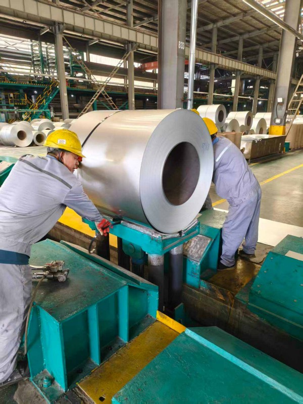 Workers processing steel coil at professional steel coil supplier factory